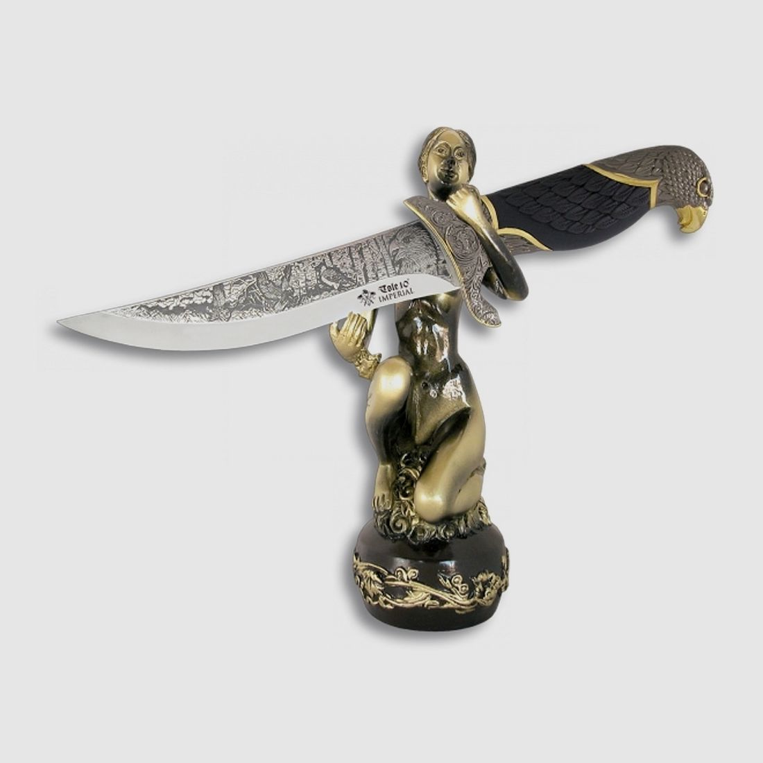 Knife with decorated handle, eagle handle and "naked woman" stand