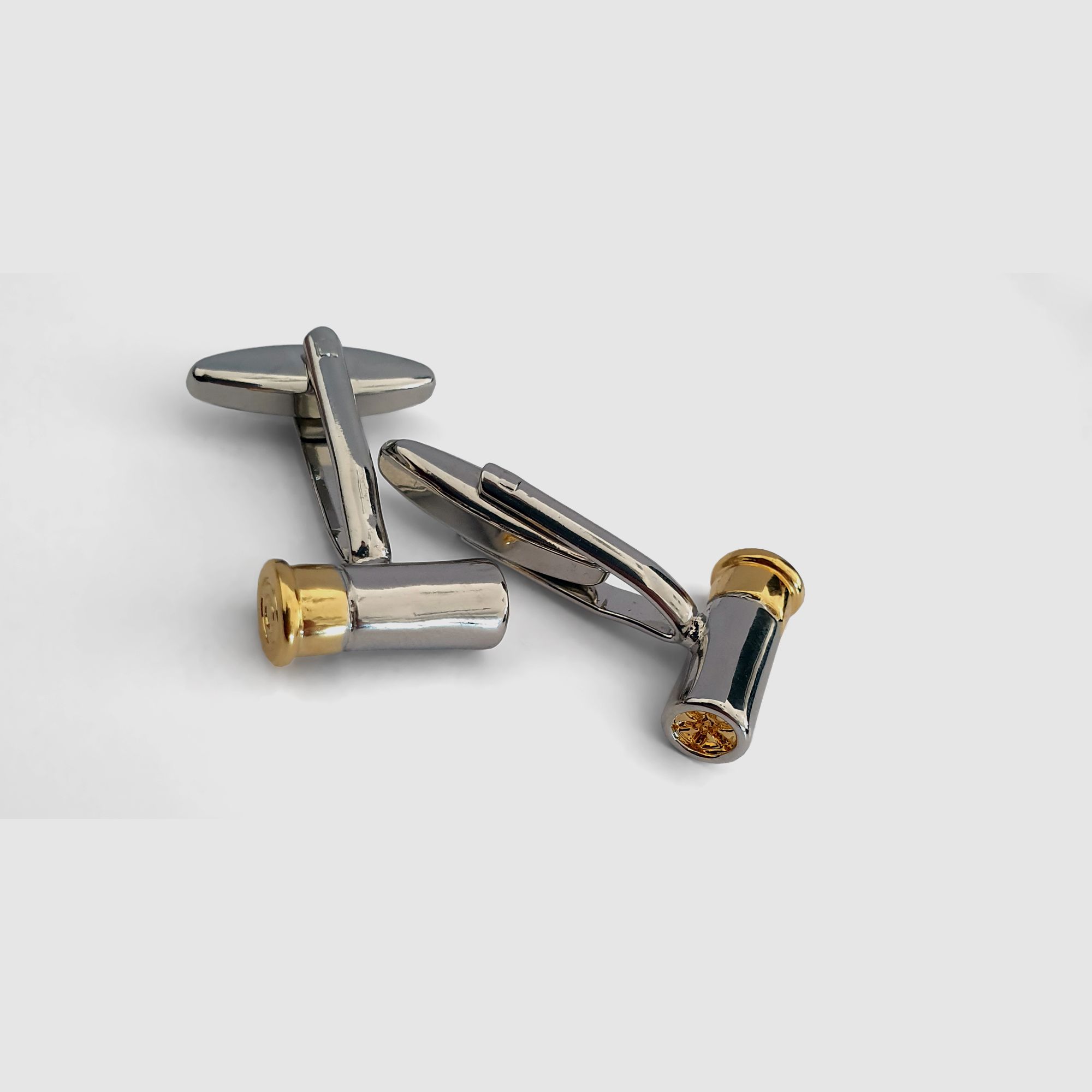 <Cufflinks in shotgun cartridge design>