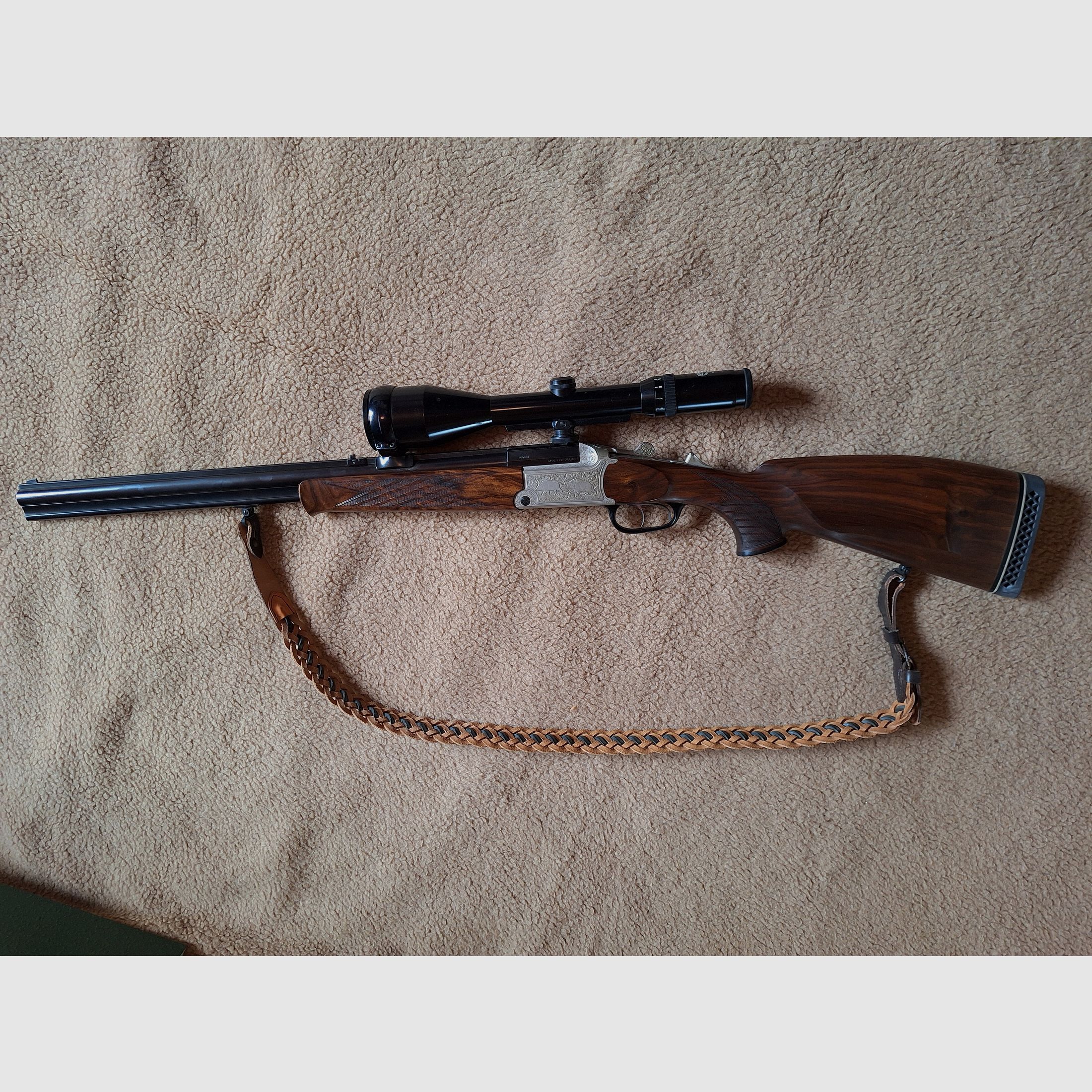 Escopeta combinada de Blaser, modelo BBF 700/88, calibre 12/70 cañón de escopeta, .30-06 cañón de rifle, visor Schmidt & Bender 2,5 - 10x