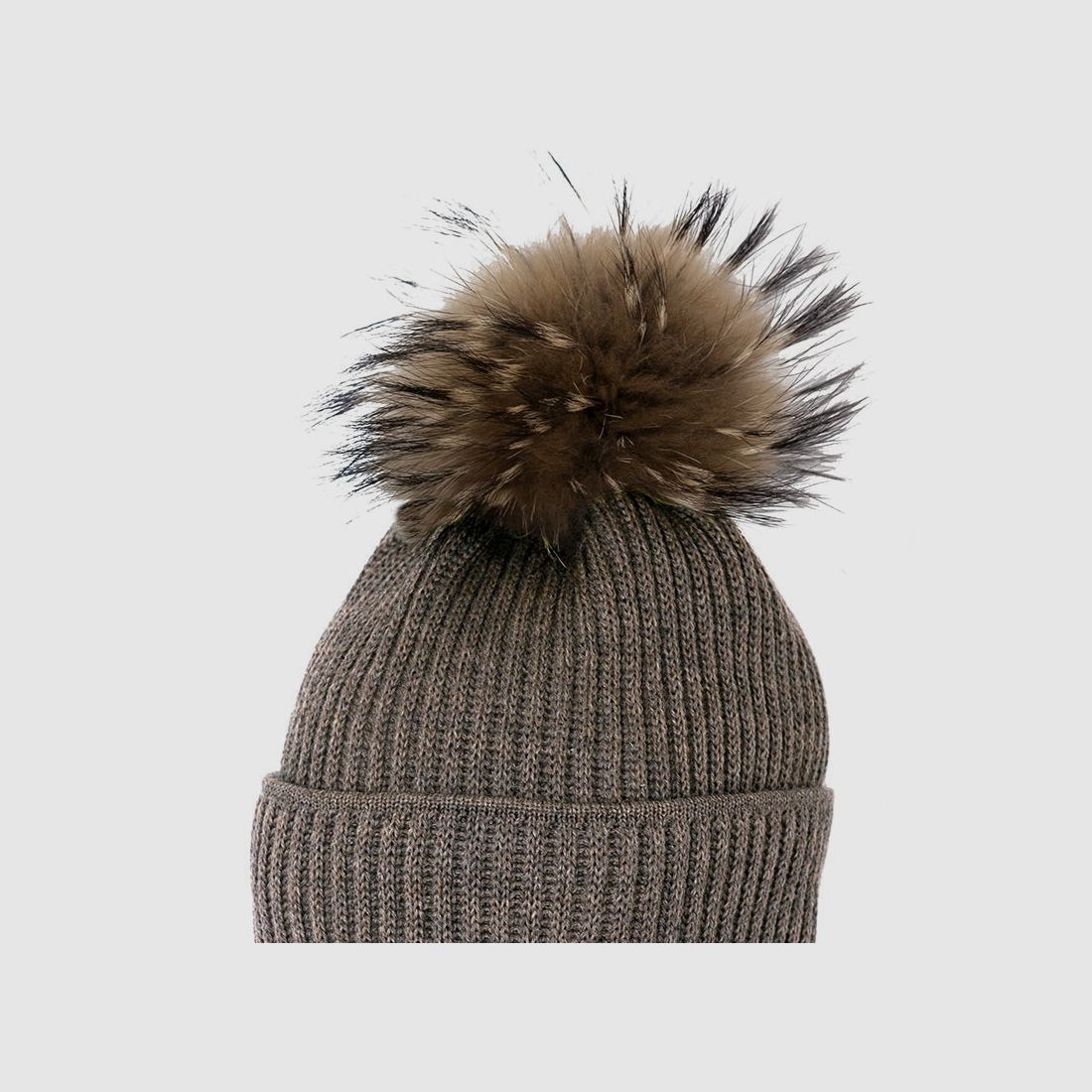 Cappello in maglia Merino con pompon in pelliccia vera e motivo a coste