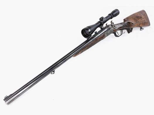 used SODIA shotgun cal. 20/76 & 6.5x57 with deep engraving and mounted Leupold 3-9x40 Plex reticle, condition: as new
