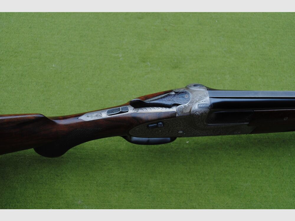 hand-engraved Merkel side lock double barrel shotgun, model 203E