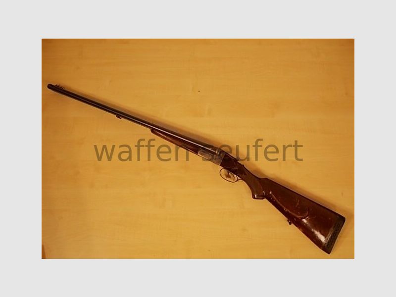 Forest double-barreled shotgun colored and engraved