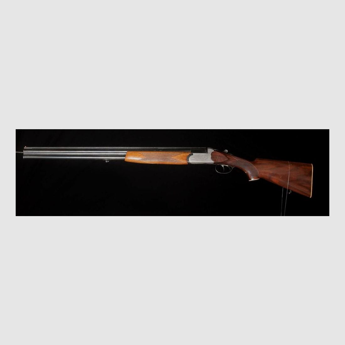 Double-barreled shotgun with ejector