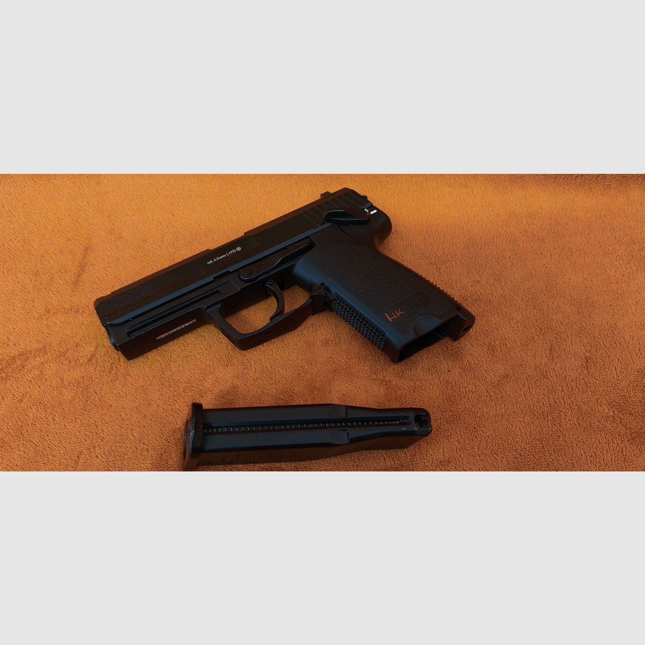 HK USP CO2 air pistol 4.5mm steel BB with signs of use