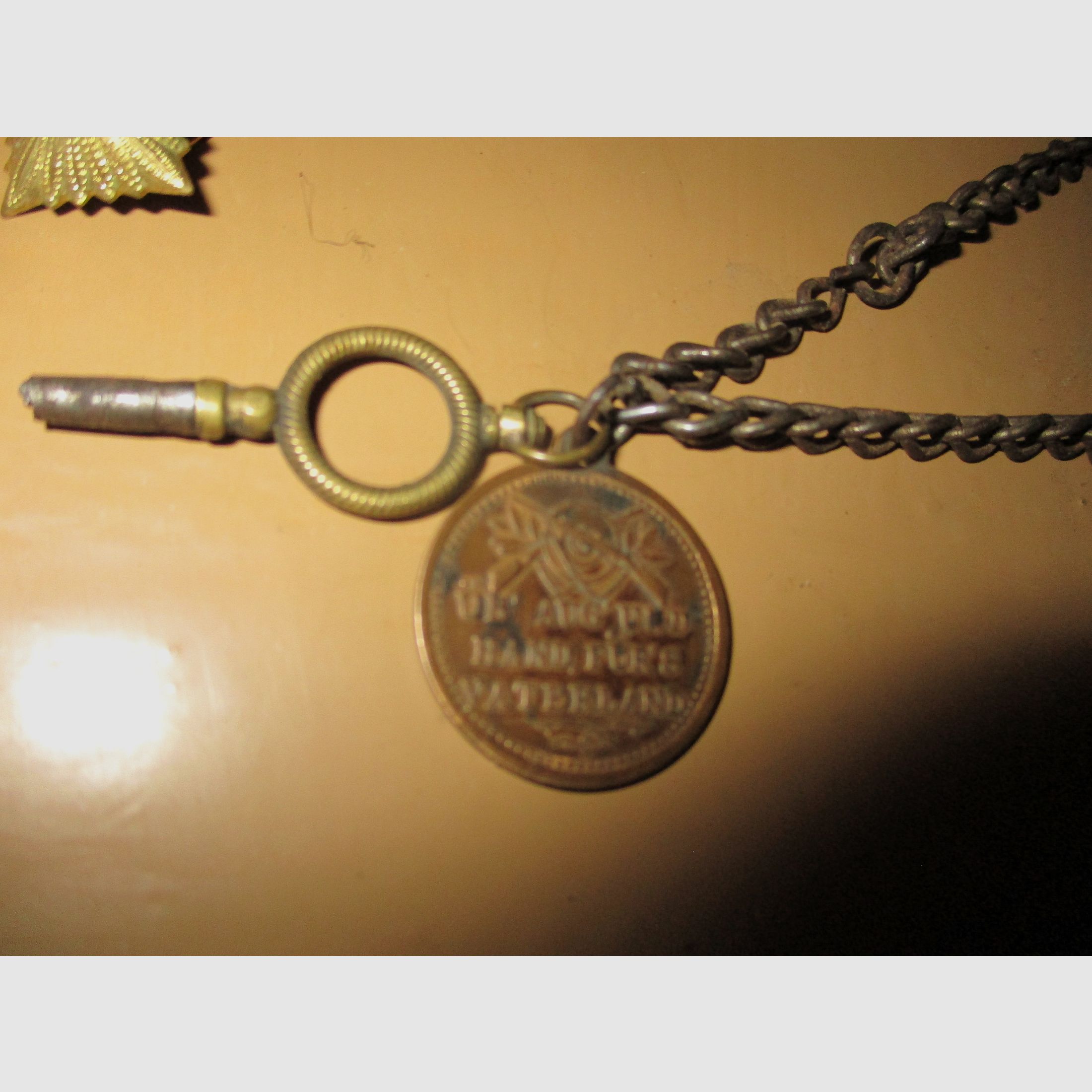 Swiss army knife, among other things, old metal ammunition box, medal on chain, among other things, military