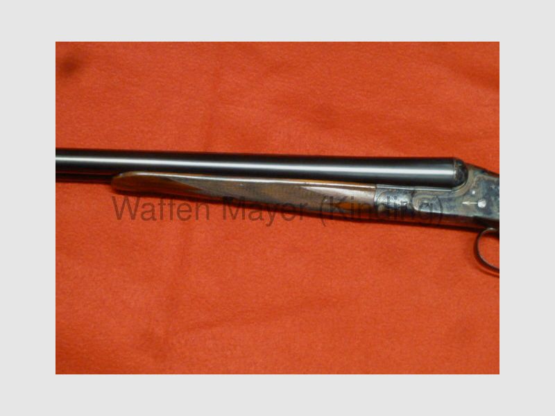 Escopeta doble con cerradura lateral Suhler