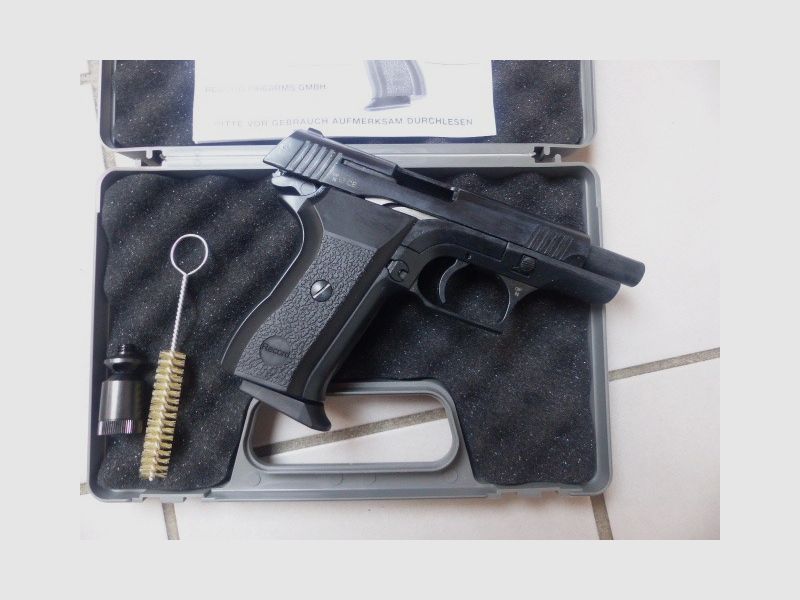 Record 2015 Cal. 9mm PAK New with case, blank firing adapter, brush, manual from collection plus 50 rounds of ammunition