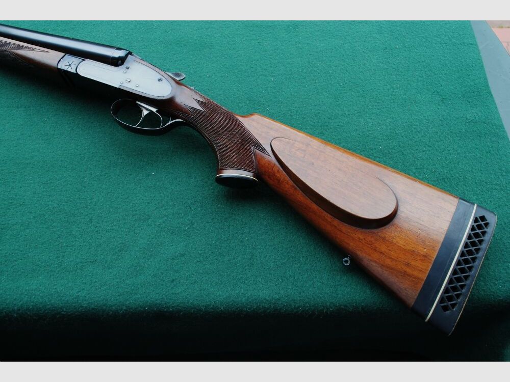 CAS escopeta de caza, auténticos cerrojos laterales, sin extractores, seguro manual.