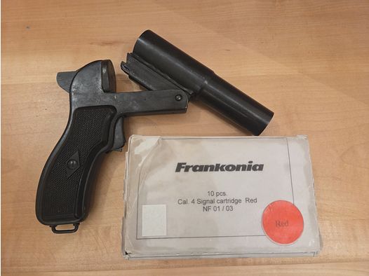 Flare gun with red signal ammunition