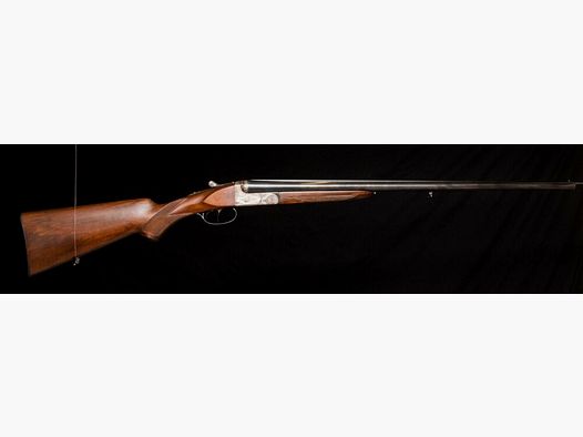 elegant double-barreled shotgun with extensive engraving