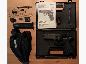 Umarex Walther P88 Compact 9mm blank gun including holster, spare magazine, launch cup, cleaning brush, transport case, and spare parts set.