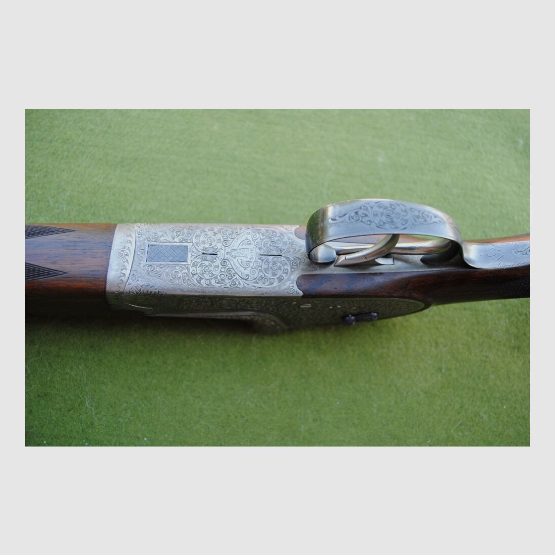 hand-engraved Merkel side lock double barrel shotgun, model 203E